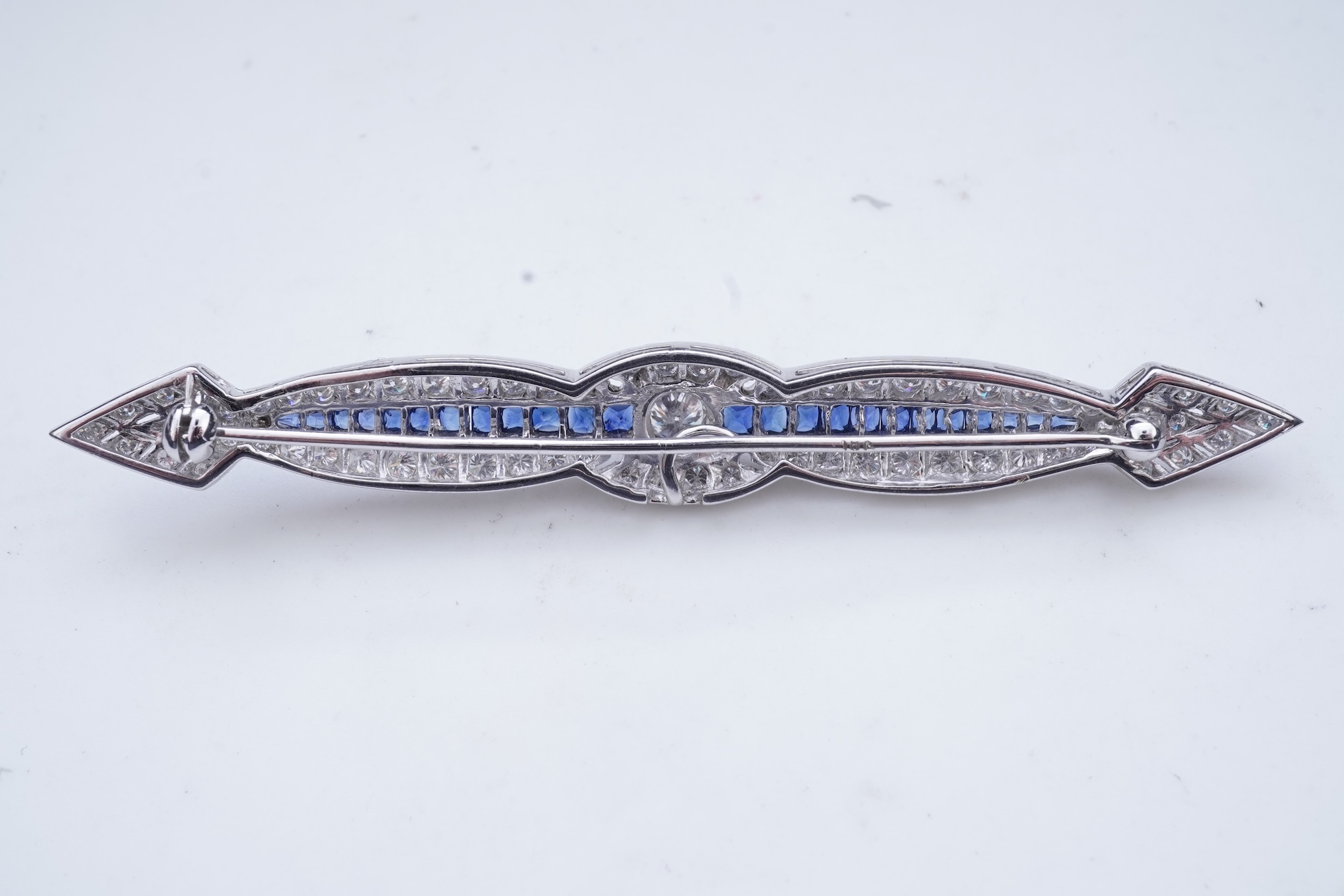 A sapphire and diamond bar brooch